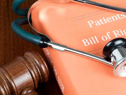 book titled Patients Bill of Rights with stethoscope on top of it and a gavel next to it