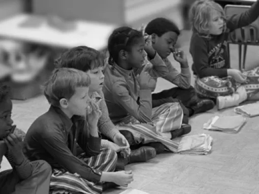 Young Kids Sitting on Classroom Floor